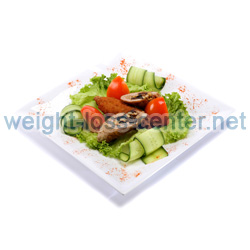 There are many ways to easily cut 100 calories daily, such as using smaller dinner plates to help with portion control.