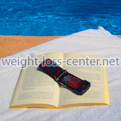 While on vacation my mobile phone has only been used as a bookmark (shown here), but can also be used for more important purposes such as losing weight.