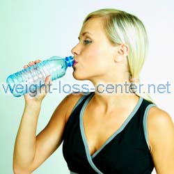 It may seem backwards, but drinking 8 or more glasses of water a day helps to prevent water retention.